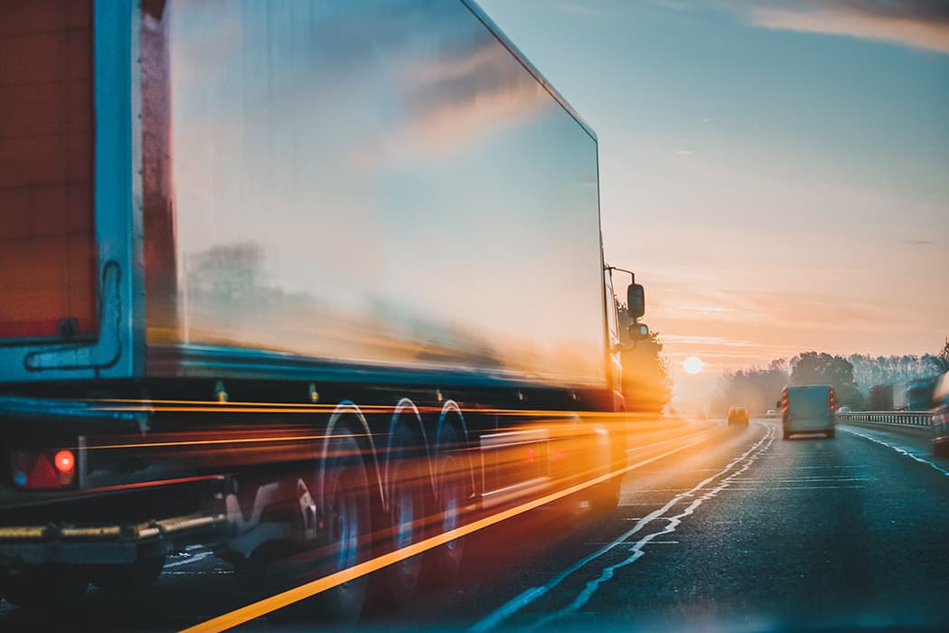 Truck driving down the highway.
