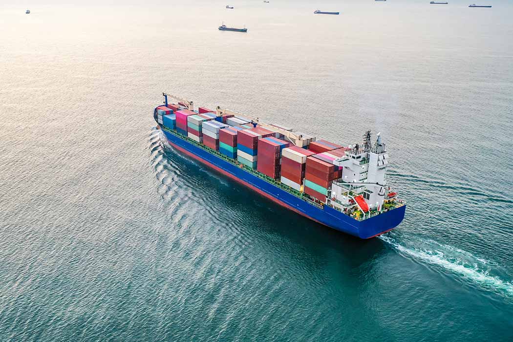 Ocean shipping vessel leaving port during contract shipping season