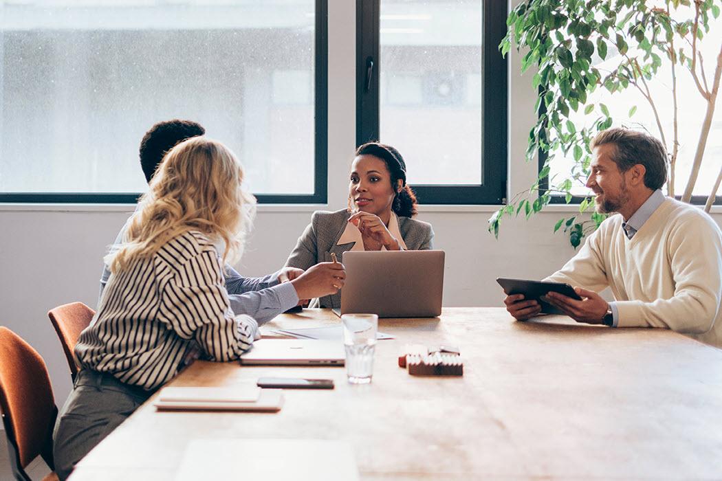 Four people in a CTPAT validation meeting