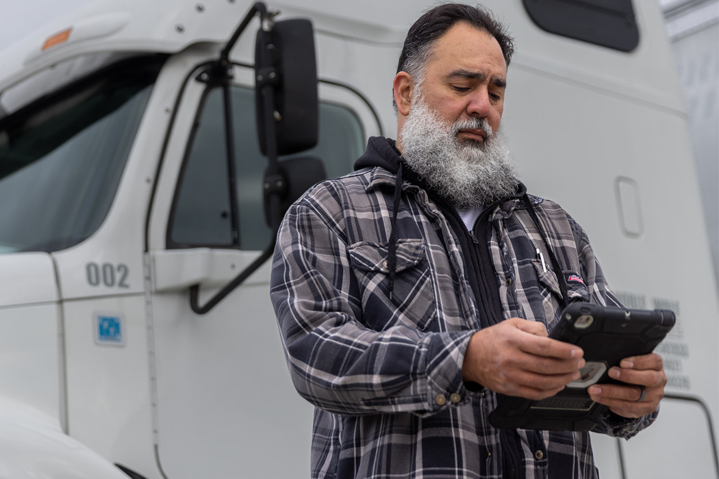 Truck driver checking details of Complemento Carta Porte (CCP)